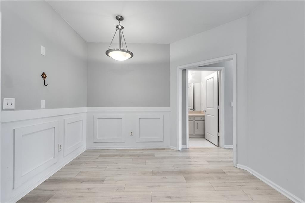 821 Ralph McGill Boulevard Northeast, Unit 3247 Atlanta, GA 30306 - Photo 11 of 43 a view of a room with wooden floor and white walls