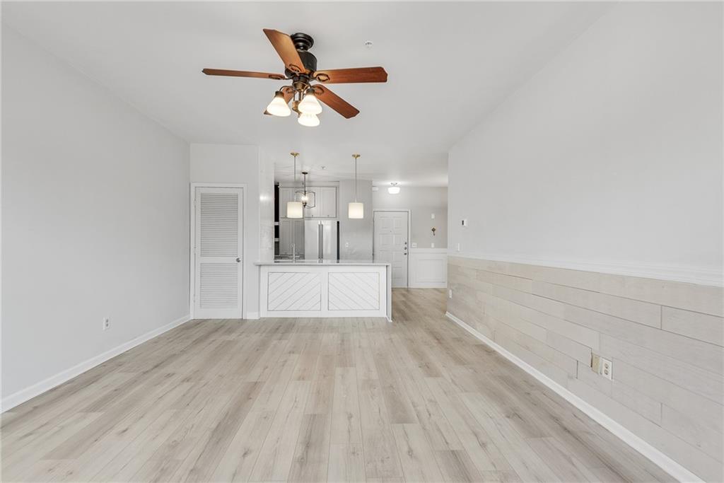 821 Ralph McGill Boulevard Northeast, Unit 3247 Atlanta, GA 30306 - Photo 14 of 43 a view of a livingroom with a ceiling fan and wooden floor