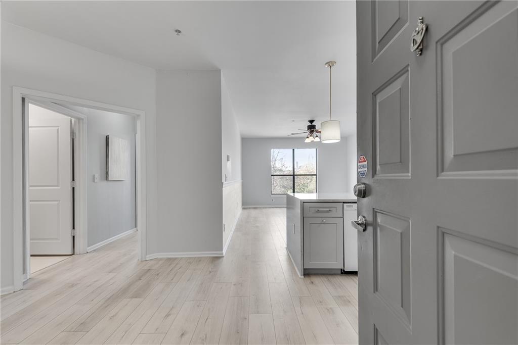 821 Ralph McGill Boulevard Northeast, Unit 3247 Atlanta, GA 30306 - Photo 15 of 43 a view of a kitchen with a sink wooden floor and windows