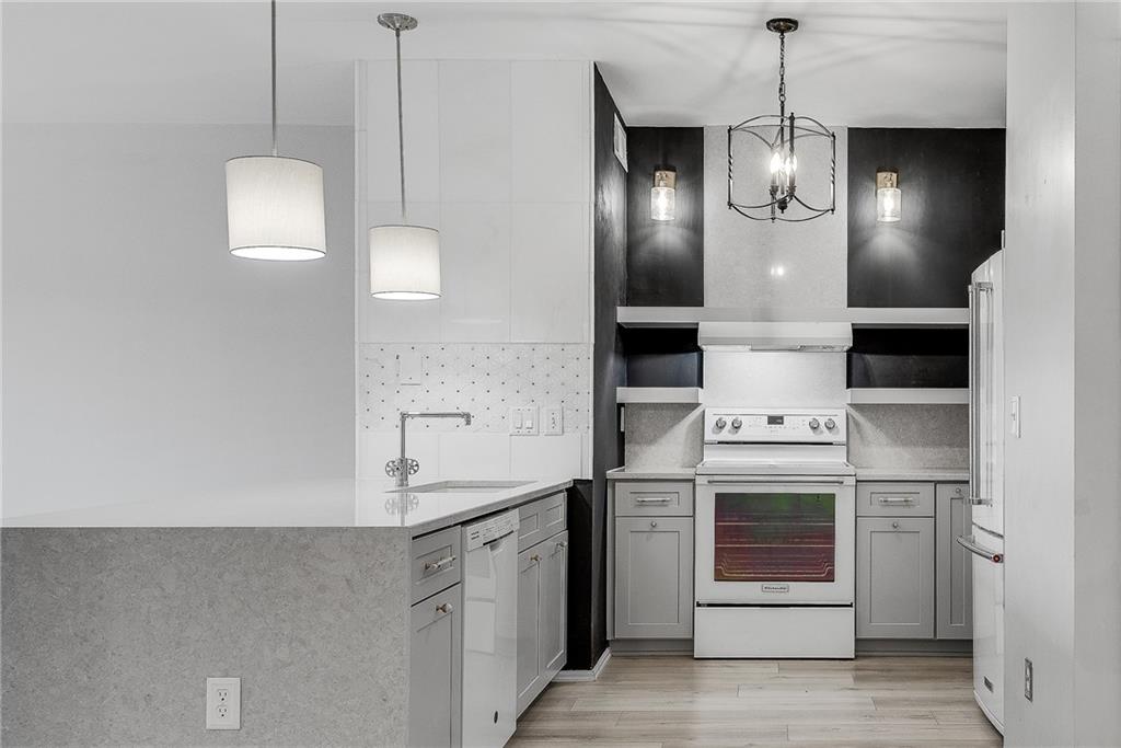 821 Ralph McGill Boulevard Northeast, Unit 3247 Atlanta, GA 30306 - Photo 17 of 43 a kitchen with stainless steel appliances granite countertop a stove a sink and a refrigerator