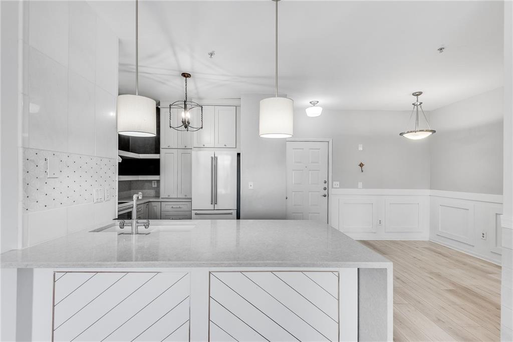 821 Ralph McGill Boulevard Northeast, Unit 3247 Atlanta, GA 30306 - Photo 18 of 43 a large kitchen with kitchen island a sink stainless steel appliances and cabinets