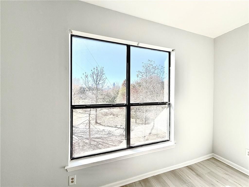 821 Ralph McGill Boulevard Northeast, Unit 3247 Atlanta, GA 30306 - Photo 2 of 43 a view of a small space with wooden floor and a window