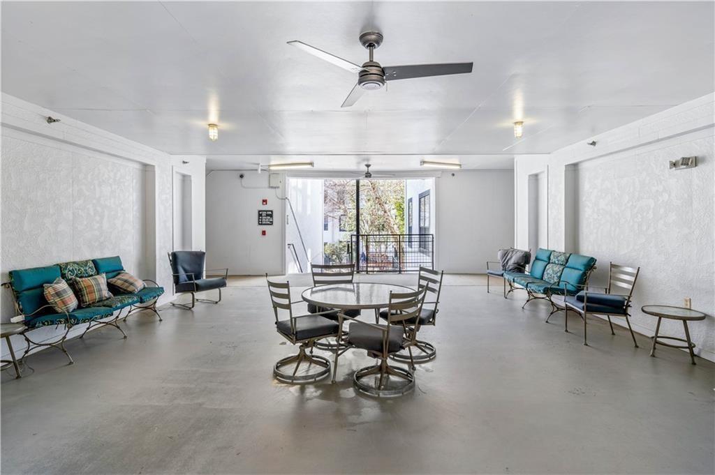 821 Ralph McGill Boulevard Northeast, Unit 3247 Atlanta, GA 30306 - Photo 36 of 43 a living room with furniture and floor to ceiling window