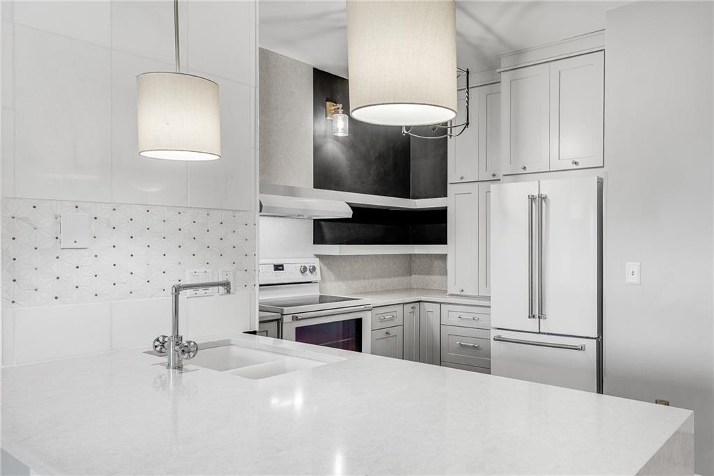 821 Ralph McGill Boulevard Northeast, Unit 3247 Atlanta, GA 30306 - Photo 4 of 43 a kitchen with stainless steel appliances a sink and a refrigerator