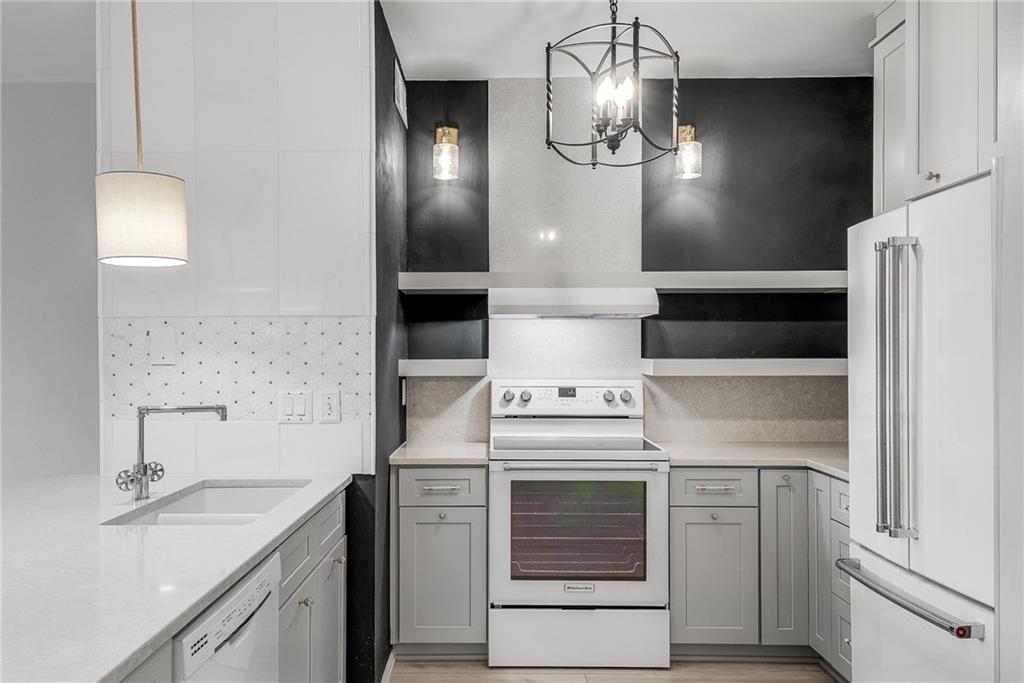 821 Ralph McGill Boulevard Northeast, Unit 3247 Atlanta, GA 30306 - Photo 8 of 43 a kitchen with a stove and a sink