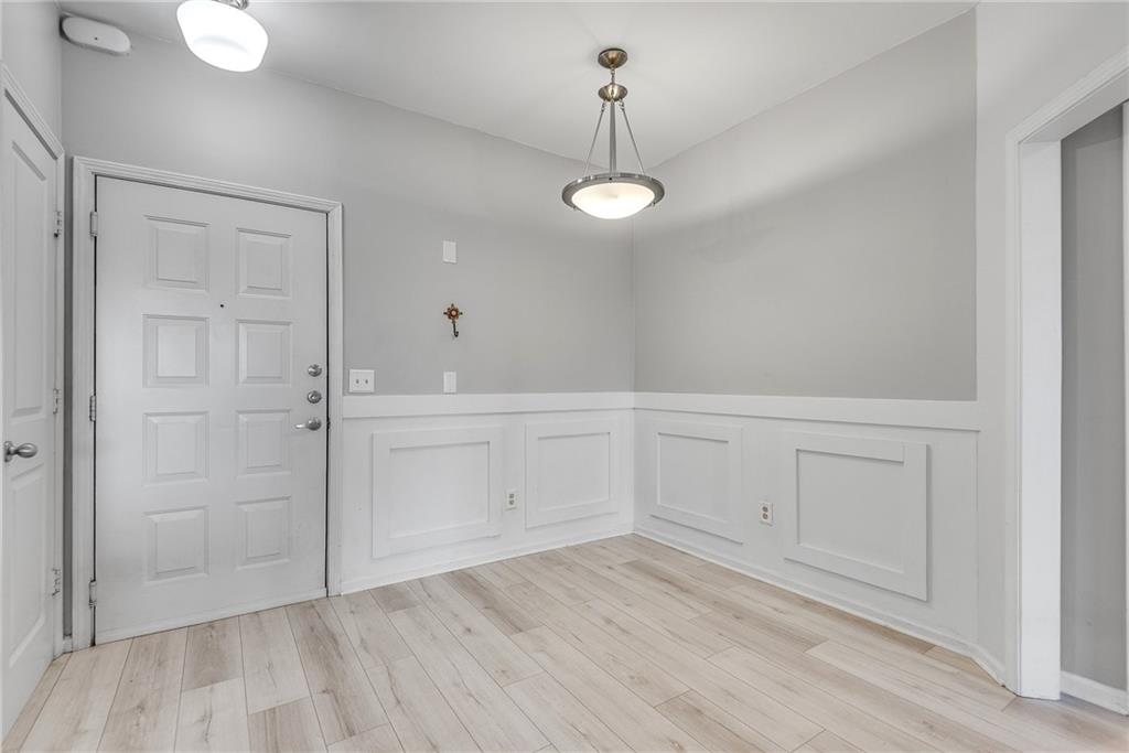821 Ralph McGill Boulevard Northeast, Unit 3247 Atlanta, GA 30306 - Photo 10 of 43 a view of empty room with wooden floor