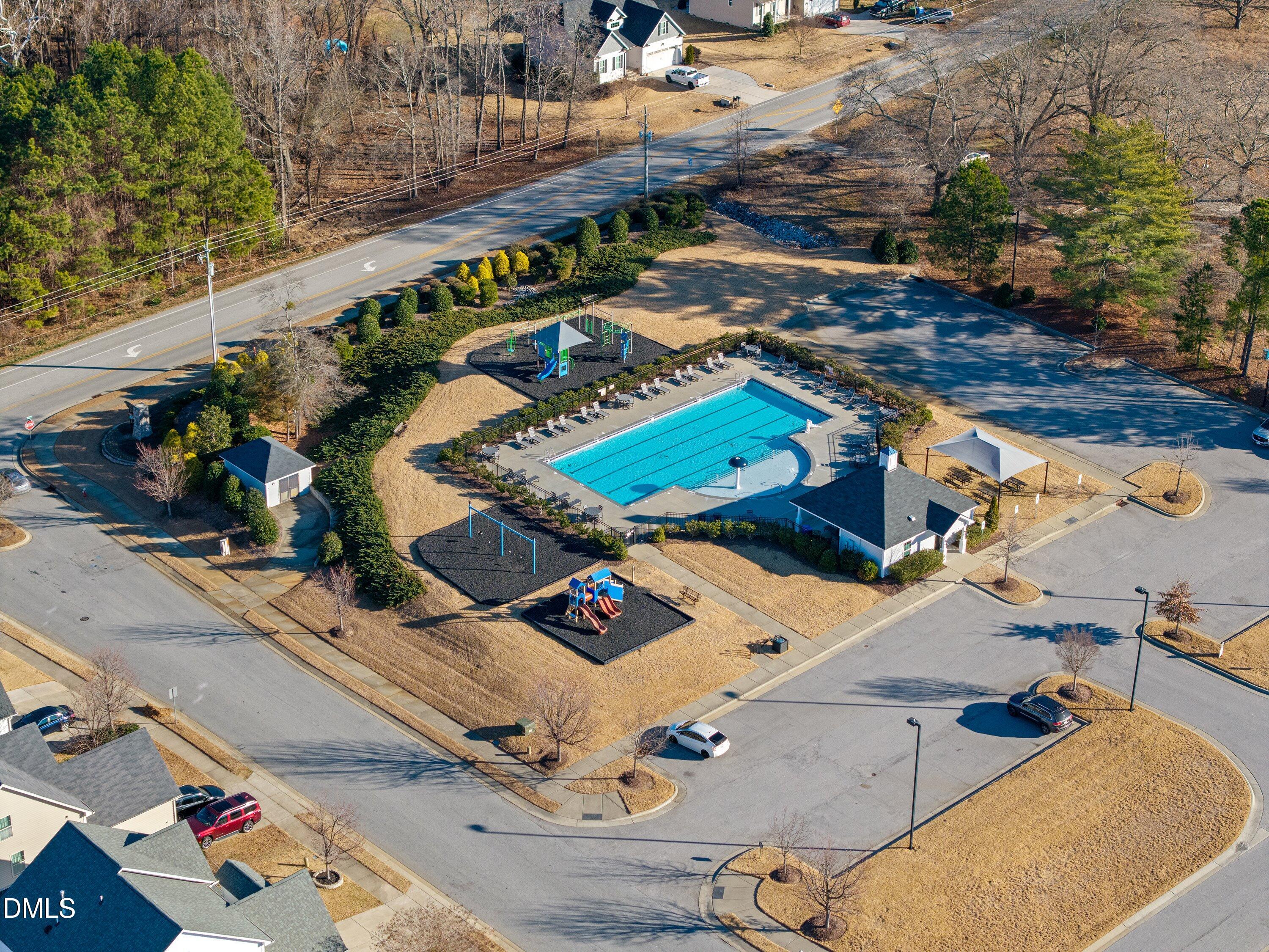 721 Maple Brook Road Fuquay-Varina, NC 27526 - Photo 55 of 59 The Community Pool and 2 playgrounds are nearby.