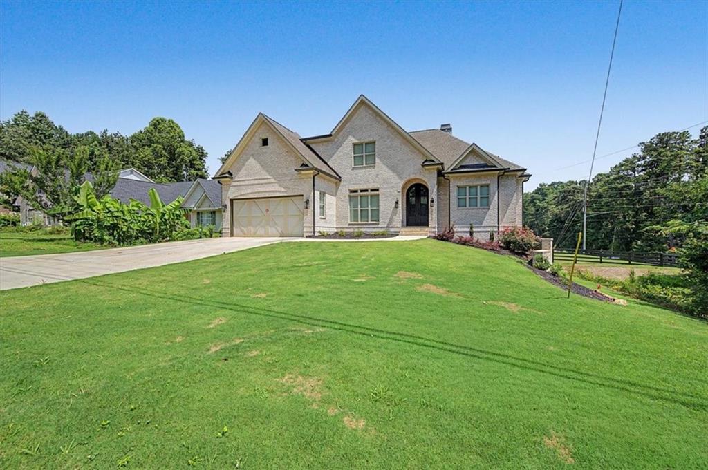 217 Laura Lake Road Marietta, GA 30066 - Photo 4 of 54 a front view of a house with a yard and trees