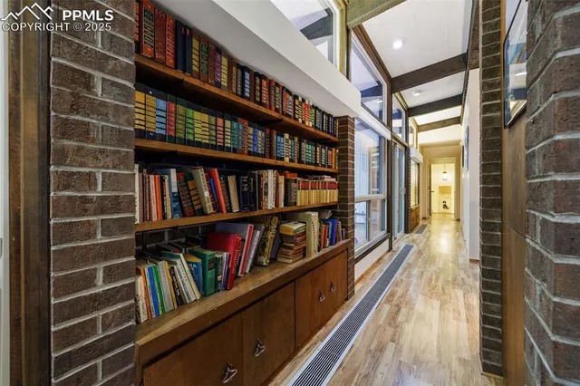 a view of a hardwood and hallway