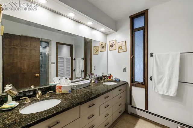 a living room with furniture and large windows