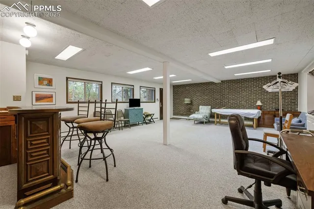 a living room with hard wood flooring and a table