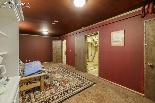 a view of a porch with chairs and backyard