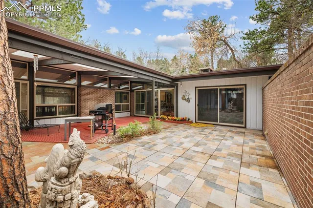 a outdoor space with lots of chairs and chandelier