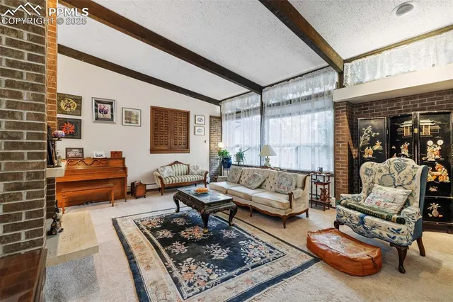 a living room with furniture and a table