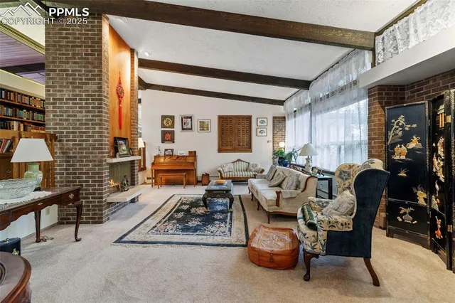 a living room with furniture and a rug
