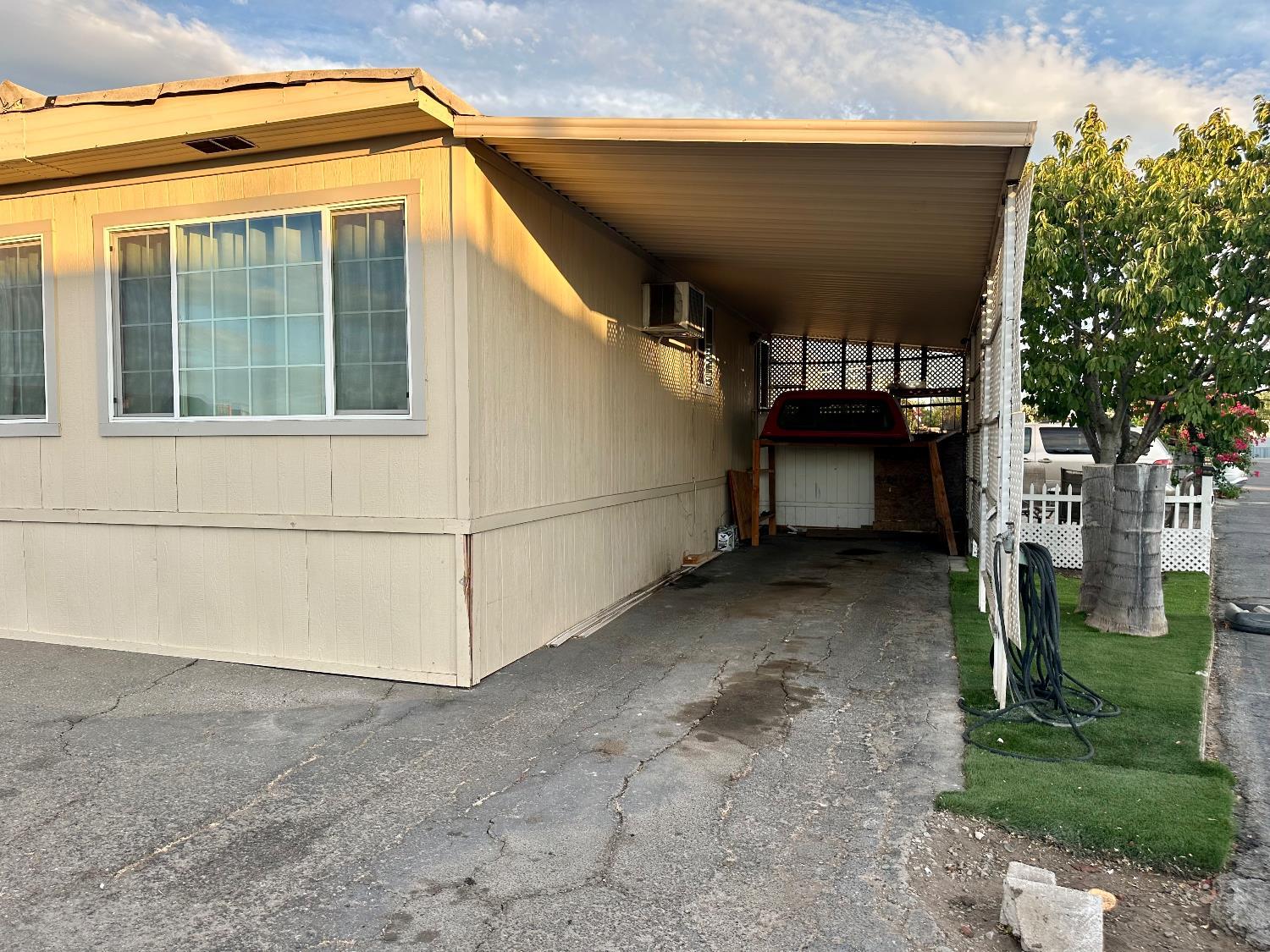 3435 Marfargoa Road, Unit 74 Stockton, CA 95215 - Photo 12 of 21 a view of garage and yard