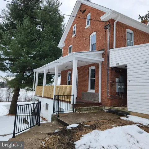 a front view of a house with balcony
