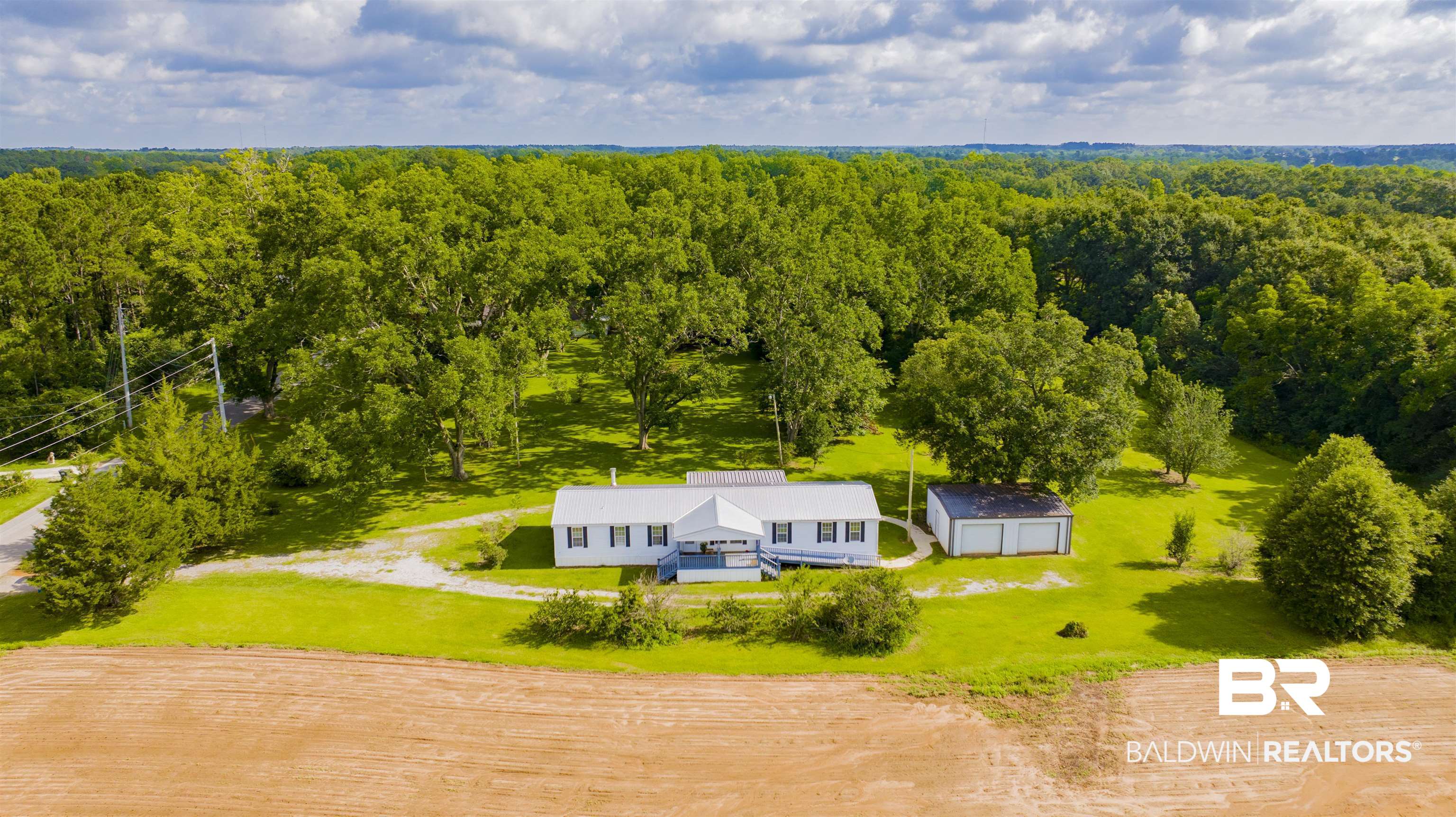 25700 County Road 71 Robertsdale, AL 36567 - Photo 37 of 40 View of subject property featuring a heavily wooded area