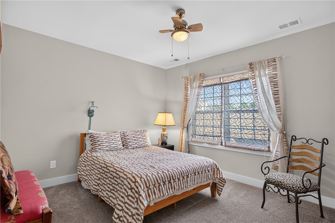 112 Tuttle Street Clemson, SC 29631 - Photo 20 of 46 Well-lit sleeping quarters with a comforting ceiling fan and ample natural light.