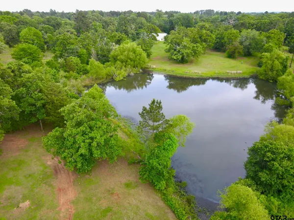 a view of a lake with a yard