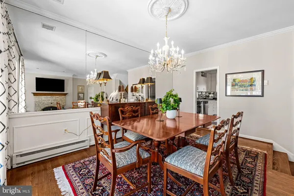 a kitchen with stainless steel appliances granite countertop a stove a sink and a white cabinets