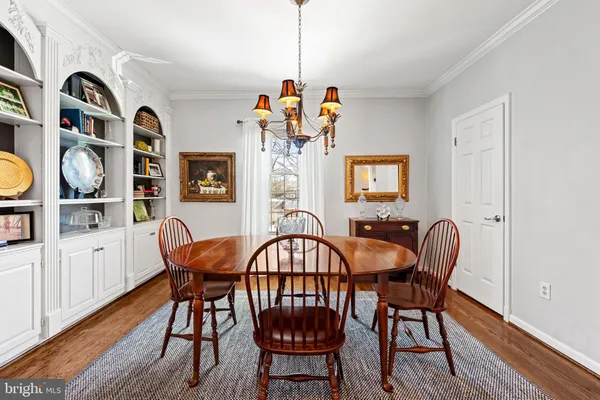 a bathroom with a sink a mirror and a lamp