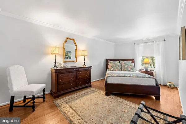 a bedroom with a bed and furniture