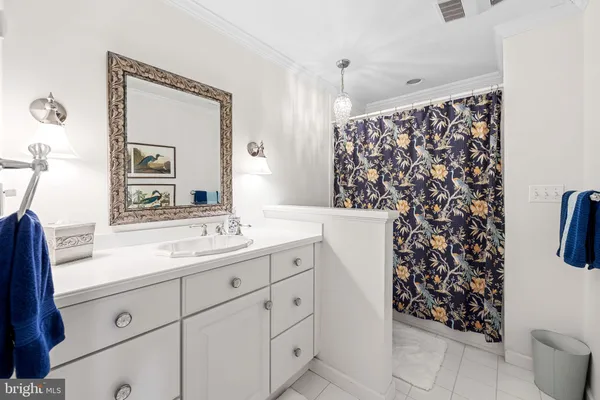 a bedroom with bed and window