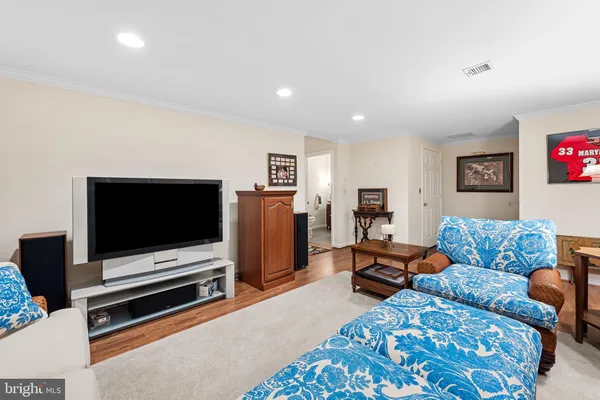 a bedroom with a bed and a mirror