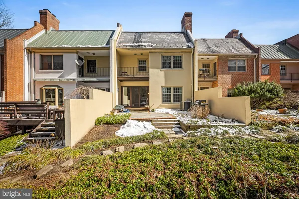 an aerial view of a house with a yard and greenery