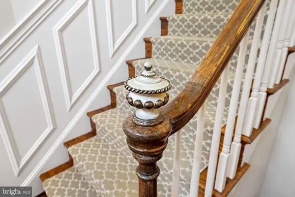 a view of entryway livingroom and hall with wooden floor