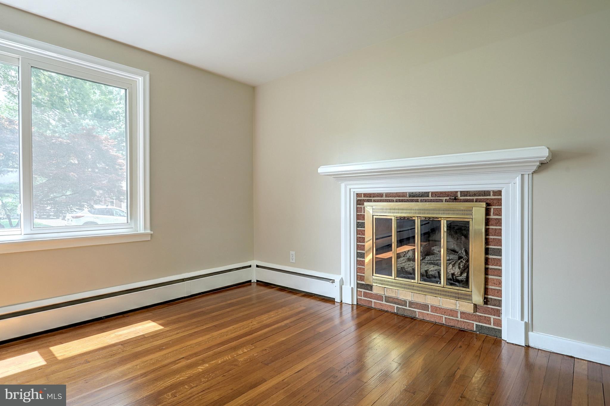 405 Edgehill Road York, PA 17403 - Photo 12 of 30 a view of an empty room with wooden floor and a window