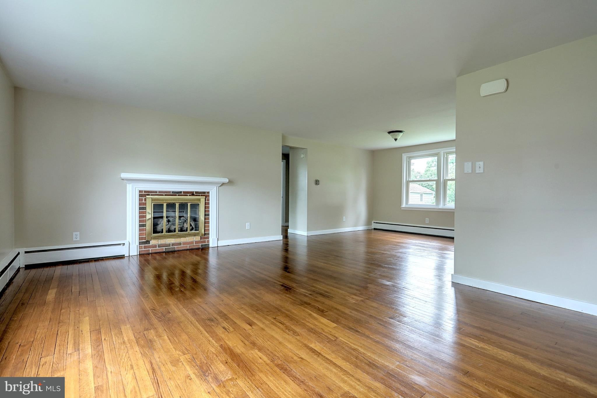 405 Edgehill Road York, PA 17403 - Photo 13 of 30 an empty room with wooden floor and windows
