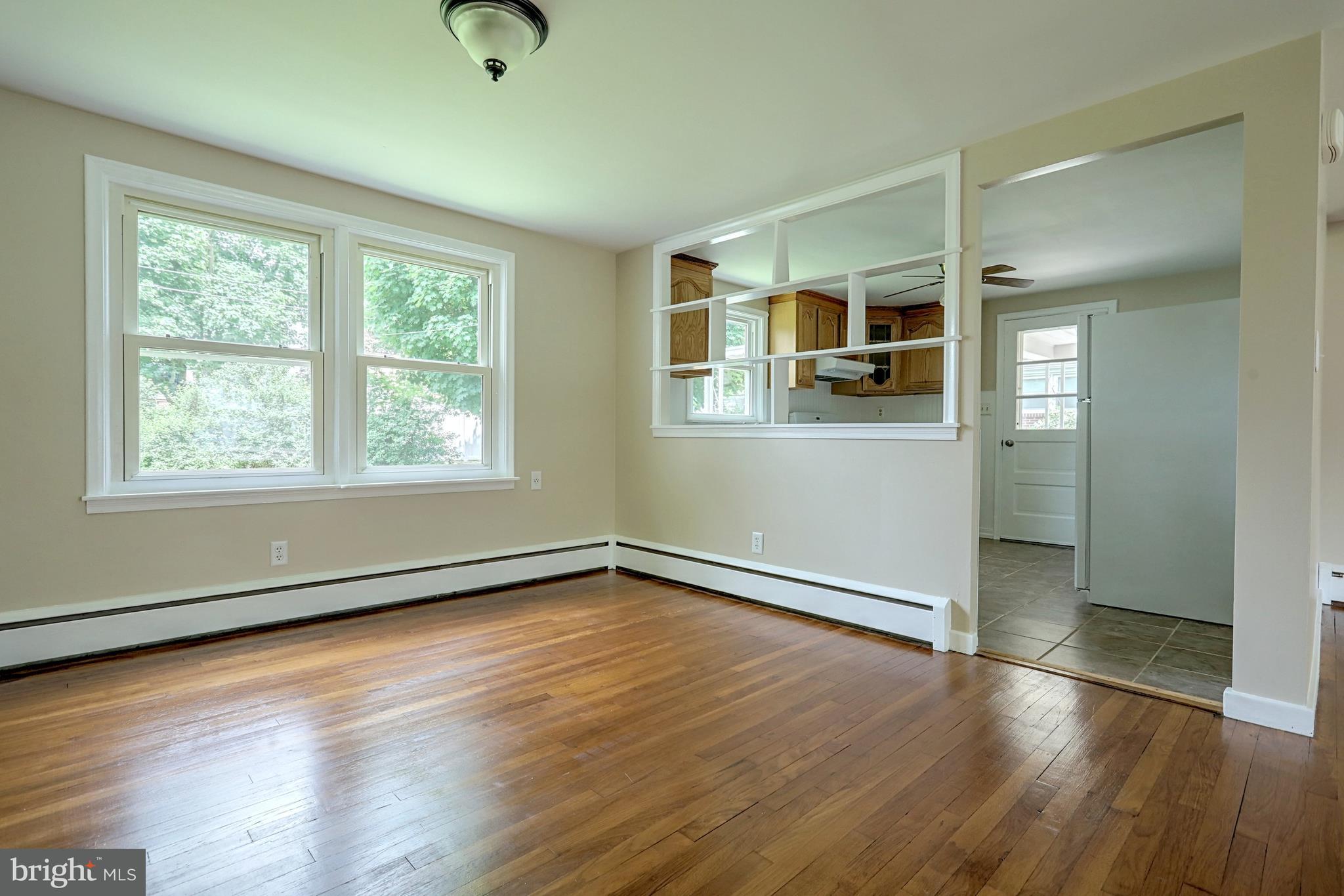 405 Edgehill Road York, PA 17403 - Photo 15 of 30 an empty room with wooden floor and windows