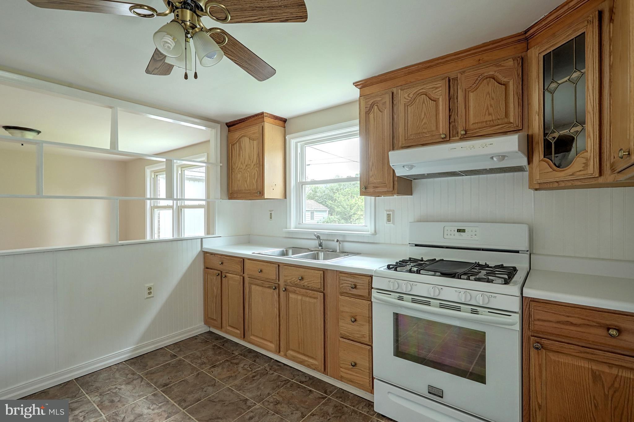 405 Edgehill Road York, PA 17403 - Photo 16 of 30 a kitchen with stainless steel appliances granite countertop a stove and a sink