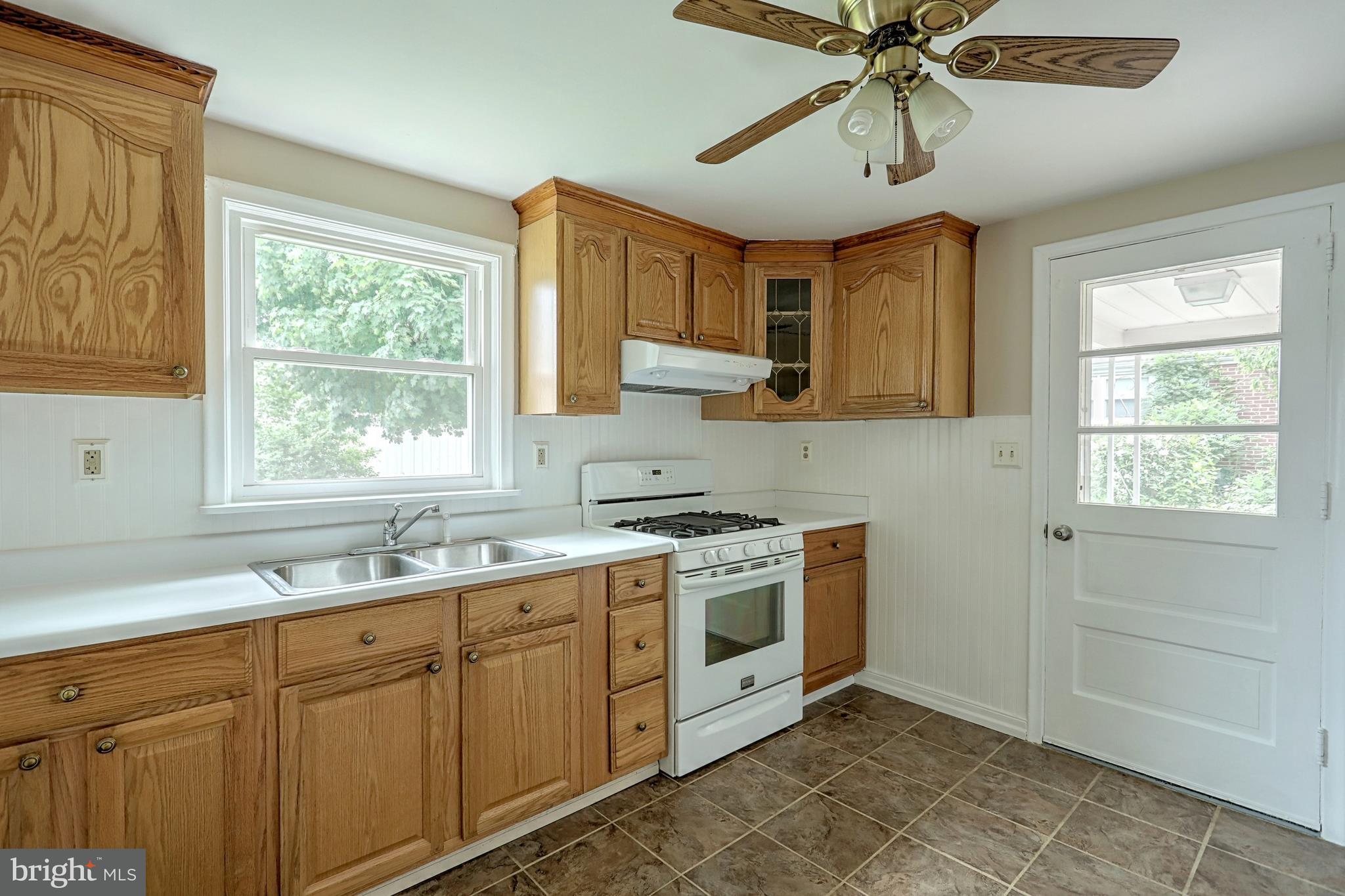 405 Edgehill Road York, PA 17403 - Photo 17 of 30 a kitchen with a sink cabinets stainless steel appliances and a window