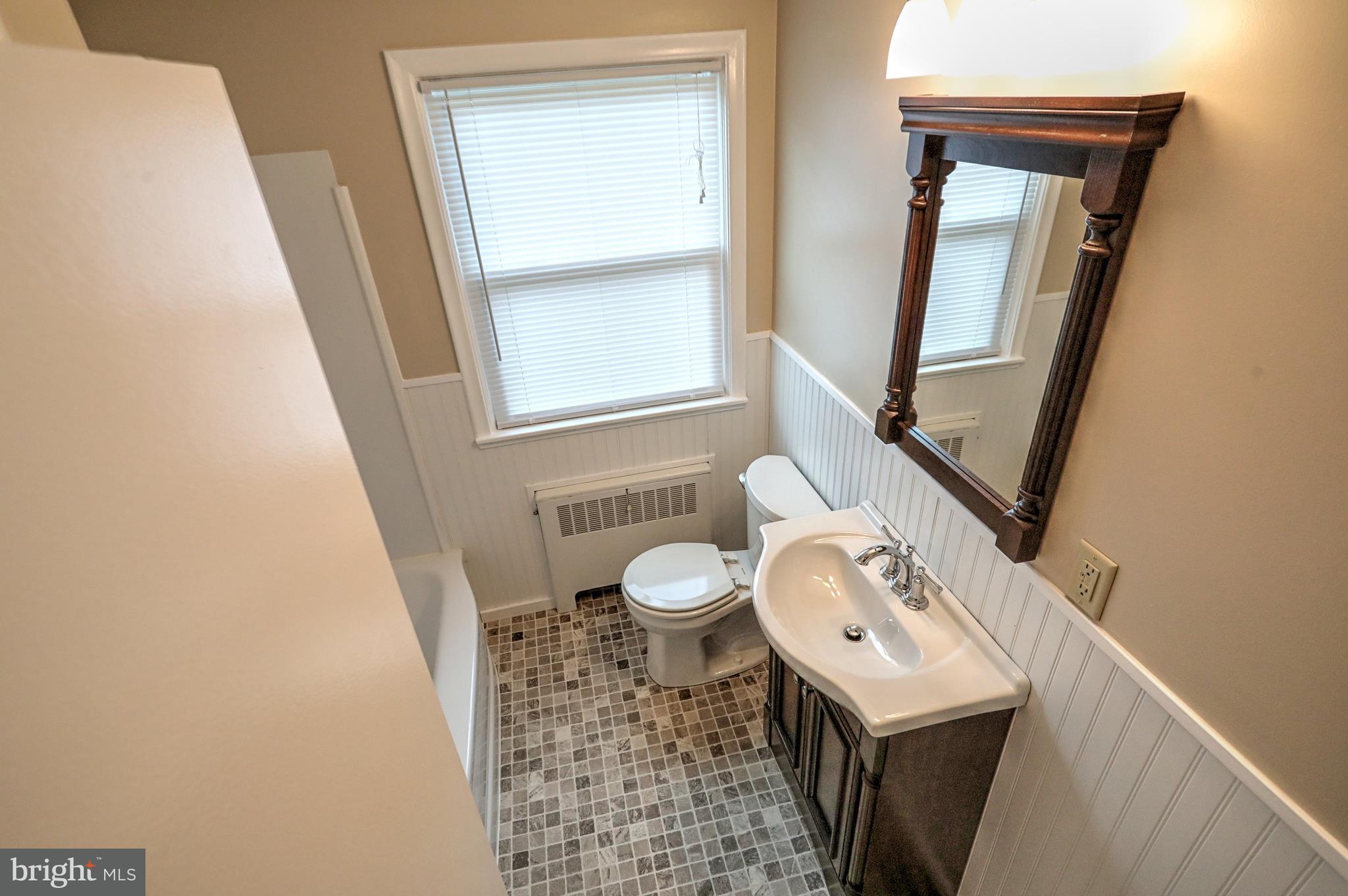 405 Edgehill Road York, PA 17403 - Photo 19 of 30 a bathroom with a toilet sink and mirror