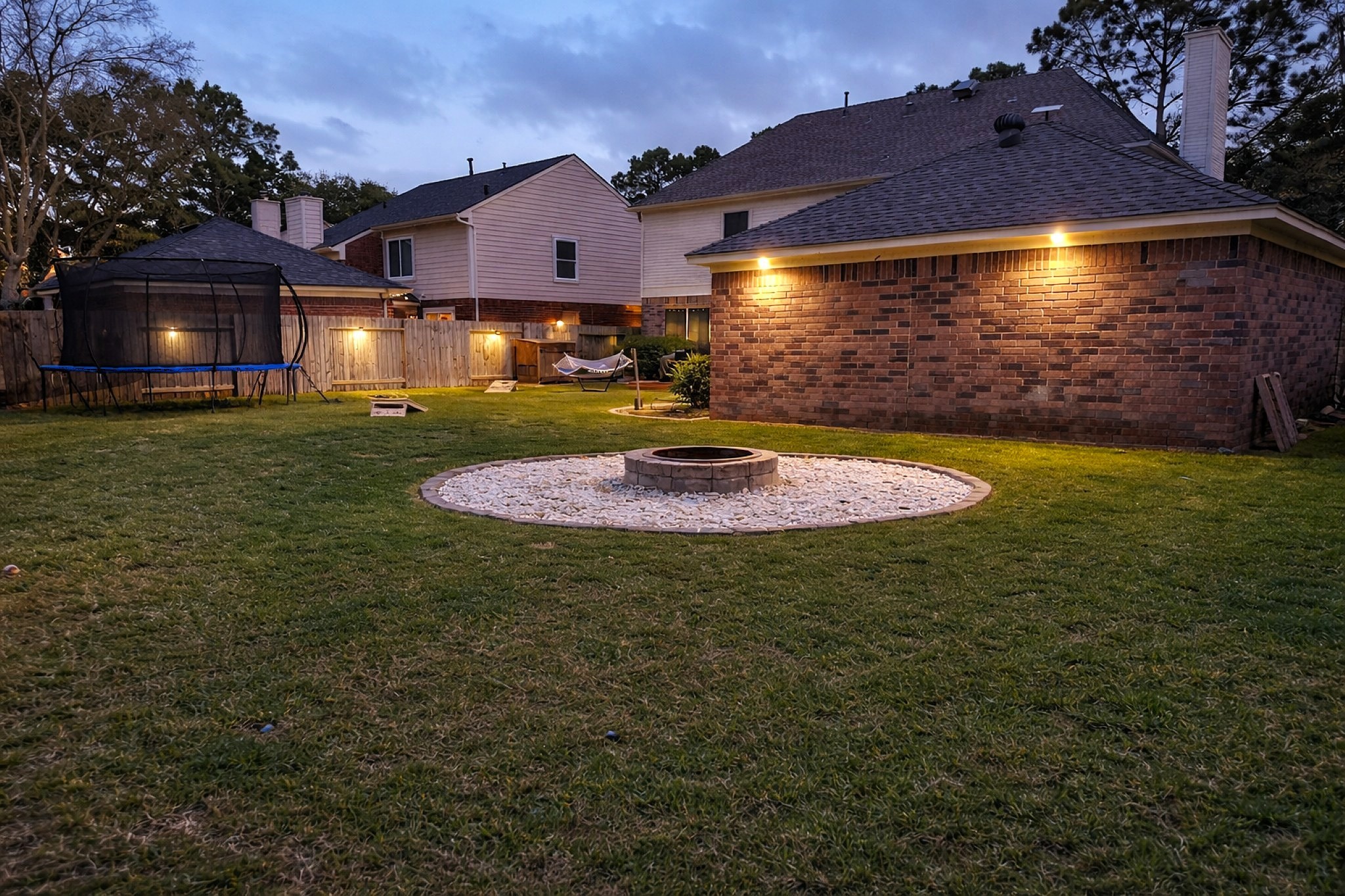 16910 Country Bridge Road Houston, TX 77095 - Photo 3 of 25 Spacious backyard with a custom fire pit area.