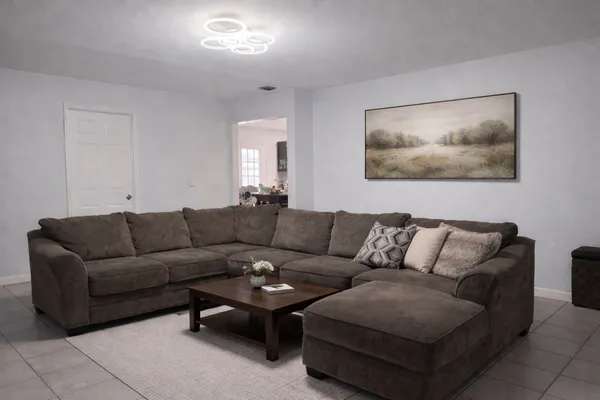a living room with furniture and a couch