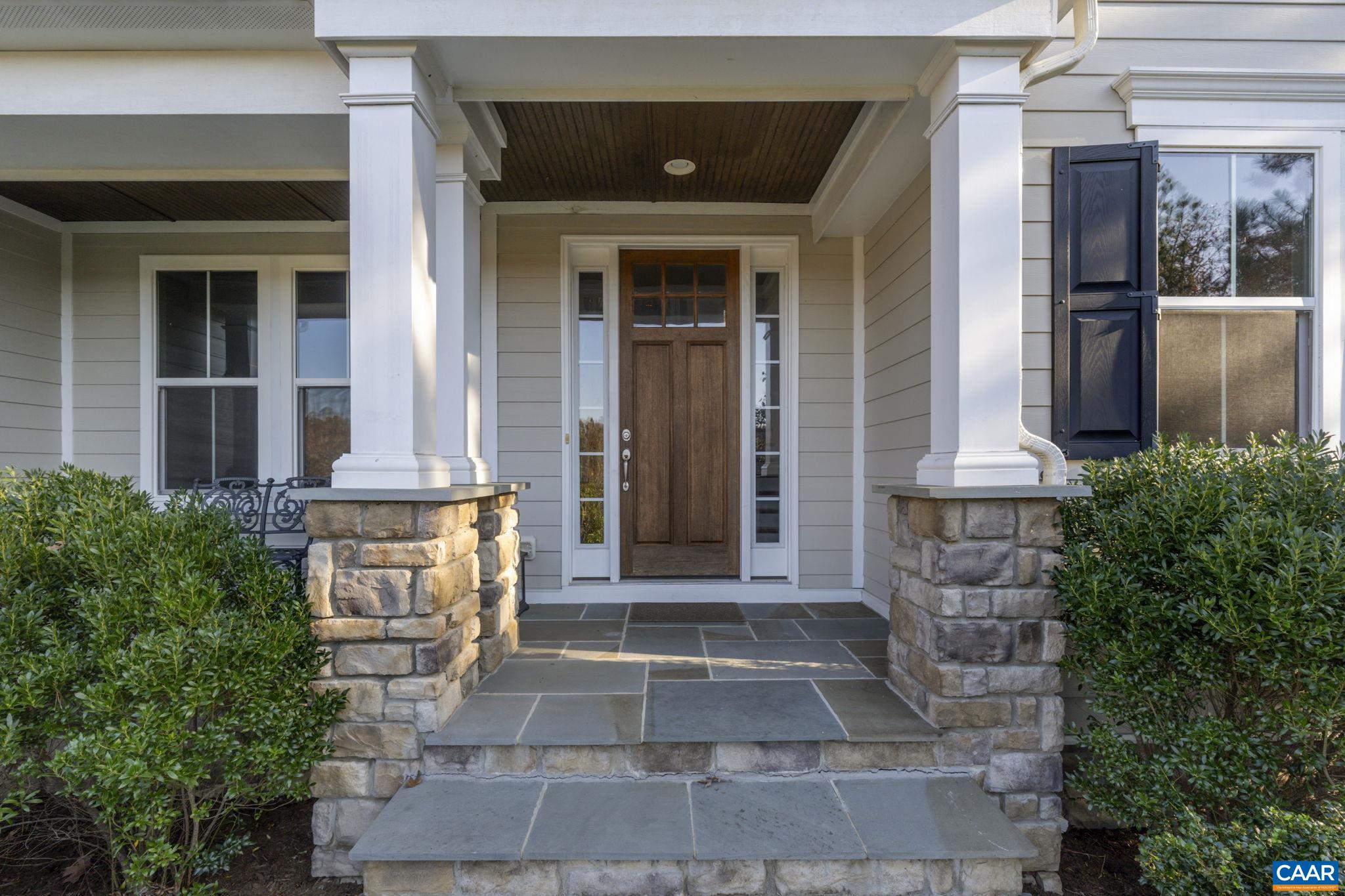3650 Newbridge Road Keswick, VA 22947 - Photo 11 of 58 a front view of a house with a porch