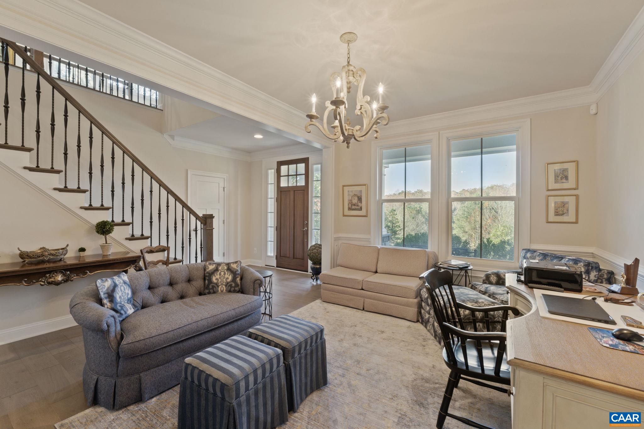 3650 Newbridge Road Keswick, VA 22947 - Photo 15 of 58 a living room with furniture or couch and a chandelier