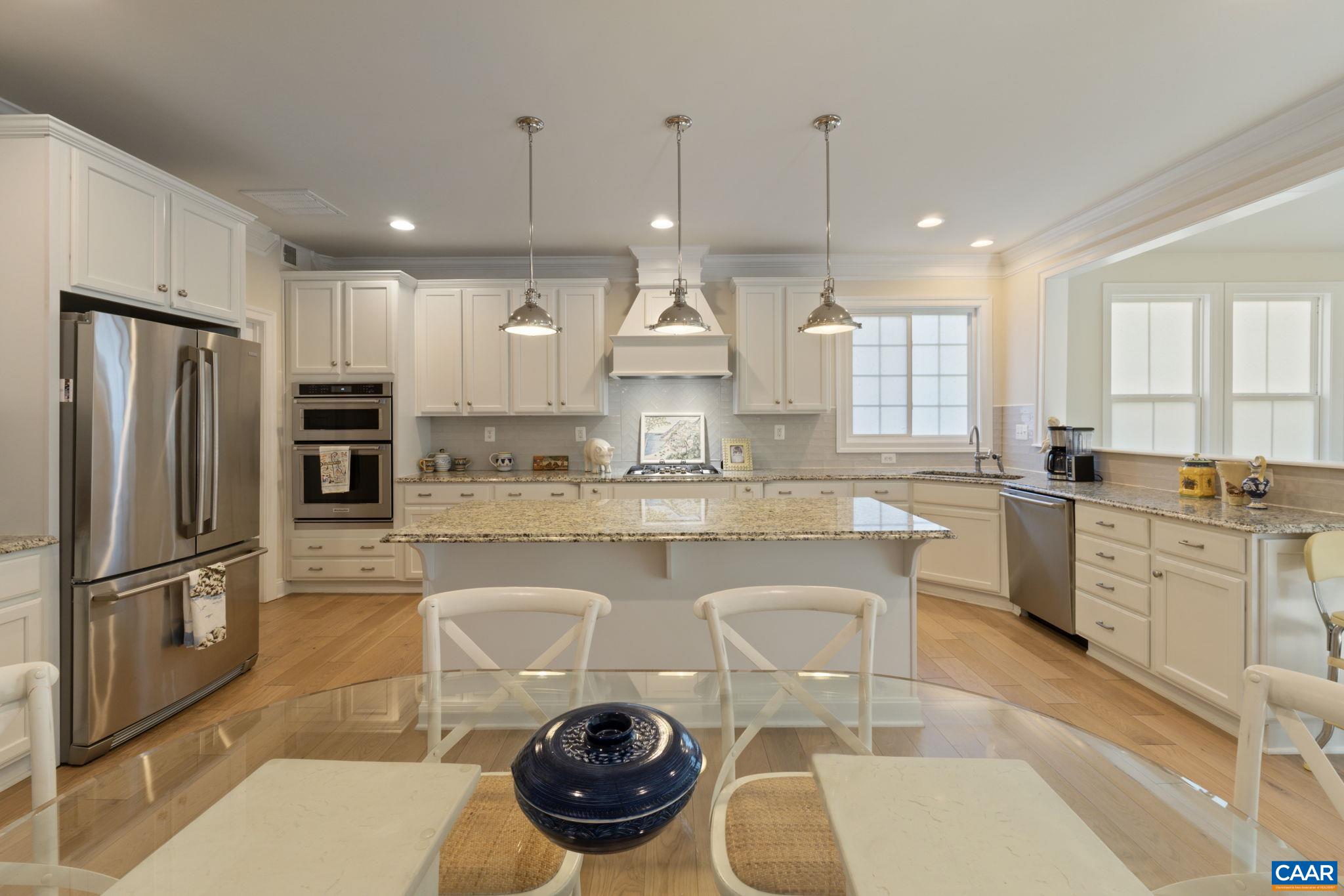 3650 Newbridge Road Keswick, VA 22947 - Photo 22 of 58 a kitchen with stainless steel appliances a stove a sink a refrigerator and cabinets