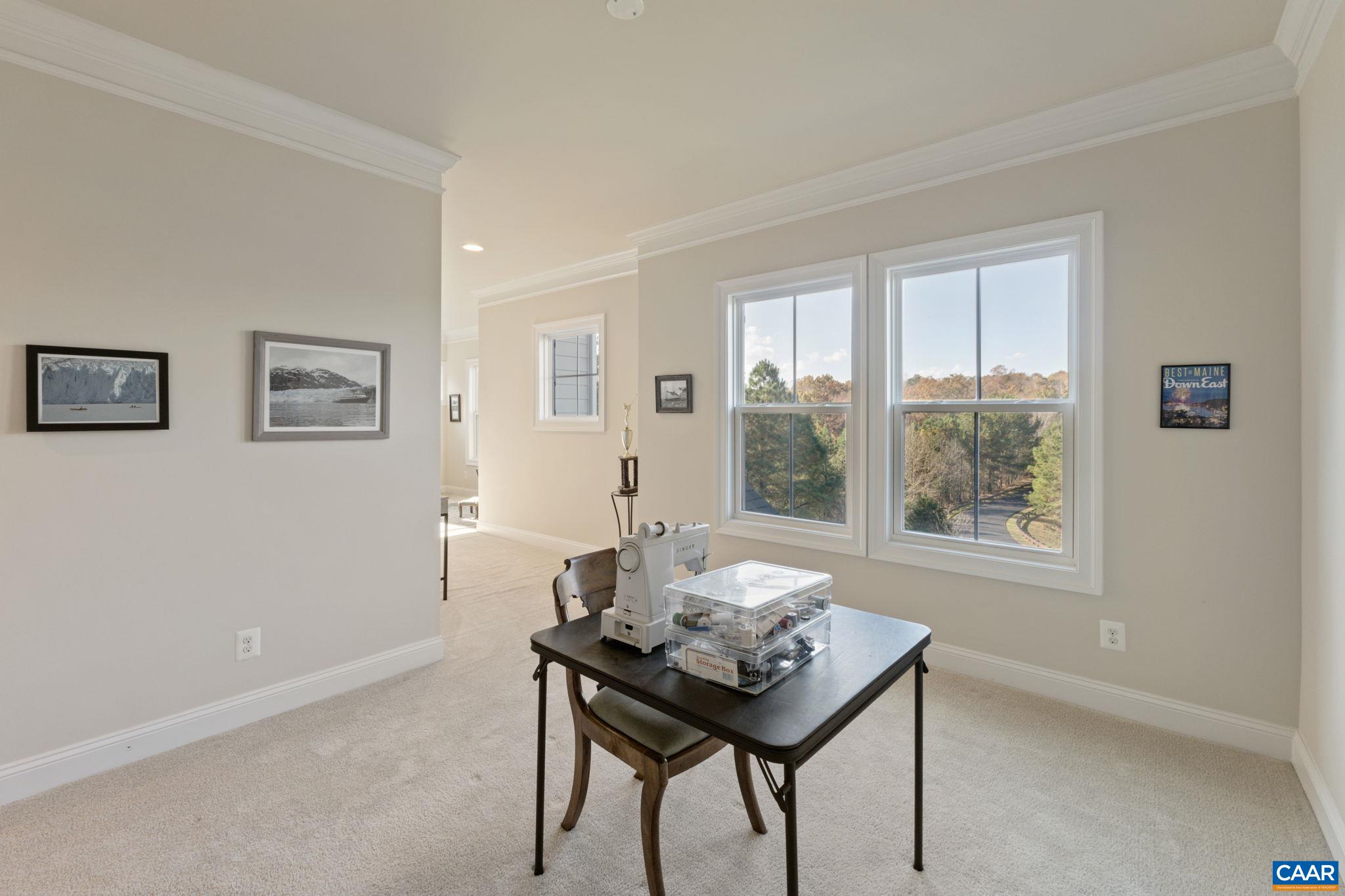 3650 Newbridge Road Keswick, VA 22947 - Photo 41 of 58 a view of a room that has a table and a chair in it