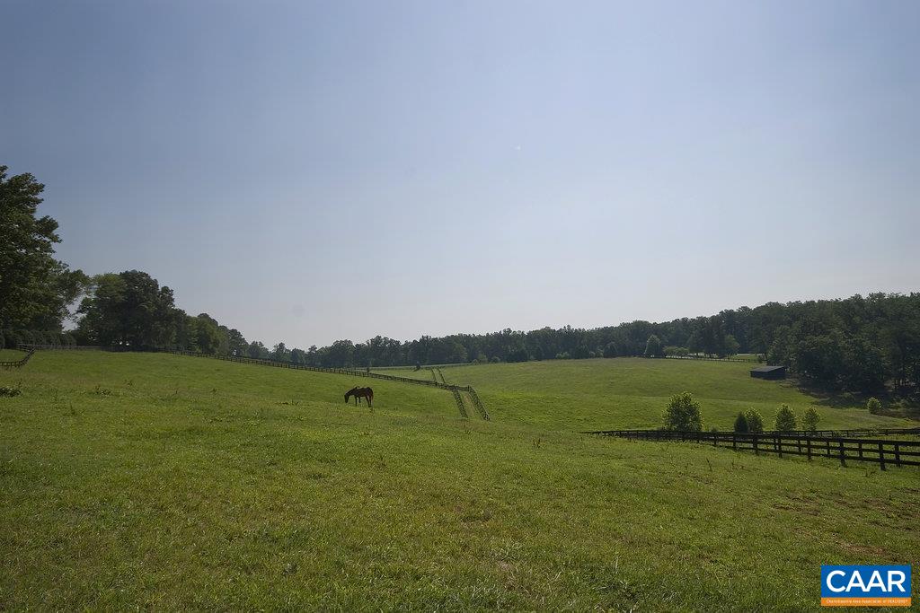 3650 Newbridge Road Keswick, VA 22947 - Photo 58 of 58 a view of a lake with a big yard