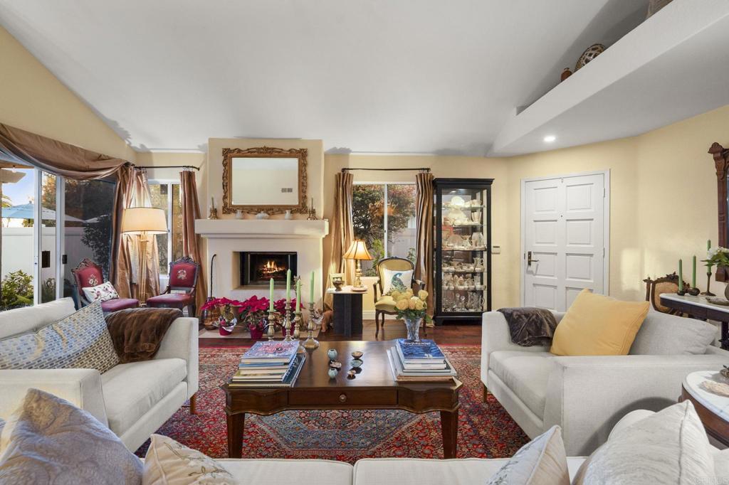 4683 Majorca Way Oceanside, CA 92056 - Photo 13 of 55 a living room with furniture fireplace and a large window