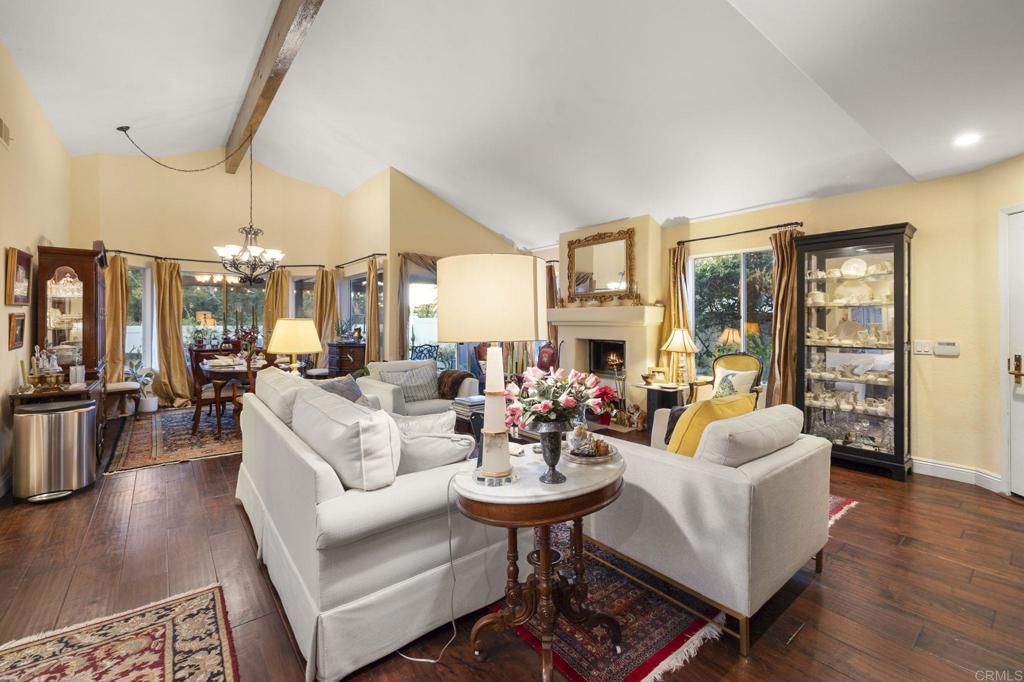 4683 Majorca Way Oceanside, CA 92056 - Photo 19 of 55 a living room with fireplace furniture and a large window