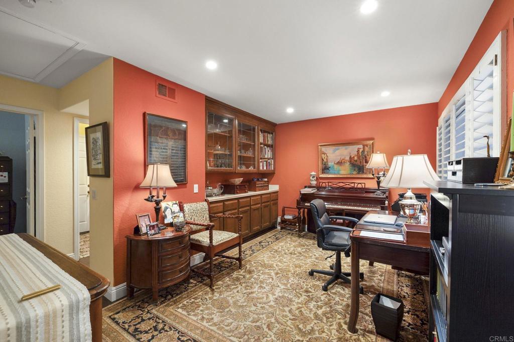 4683 Majorca Way Oceanside, CA 92056 - Photo 20 of 55 a living room with furniture a rug and a piano