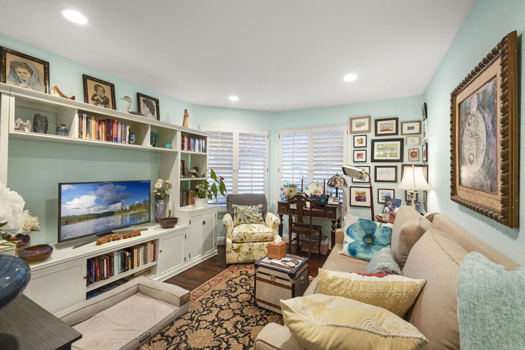 4683 Majorca Way Oceanside, CA 92056 - Photo 22 of 55 a living room with furniture a flat screen tv and a fireplace
