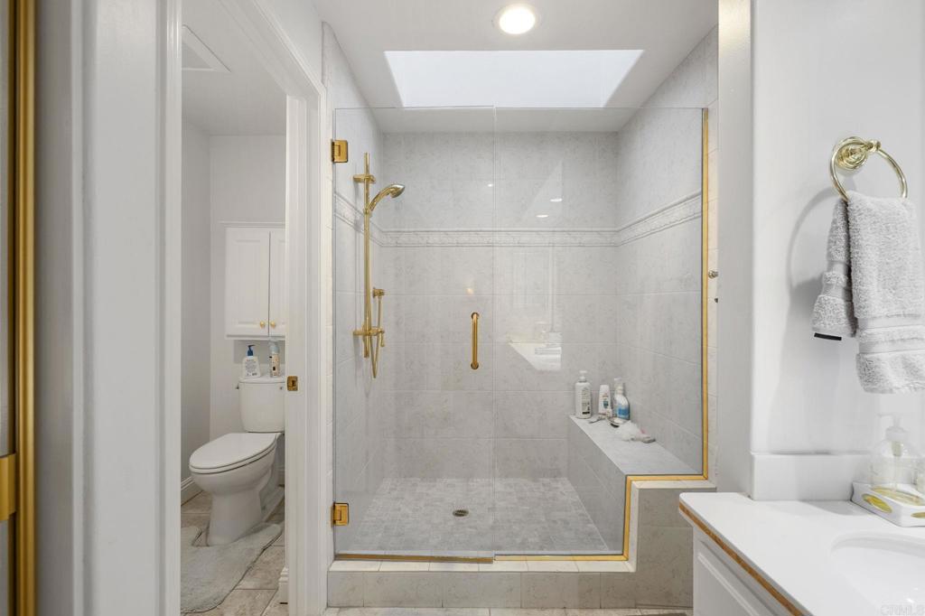 4683 Majorca Way Oceanside, CA 92056 - Photo 28 of 55 a bathroom with a shower and a toilet
