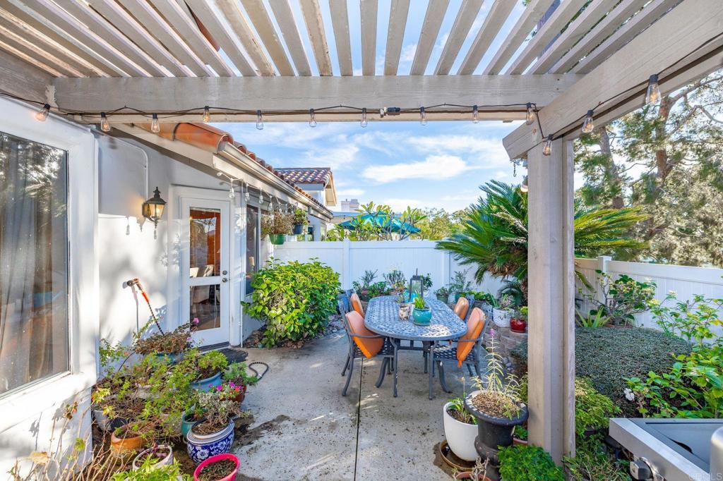 4683 Majorca Way Oceanside, CA 92056 - Photo 30 of 55 a outdoor dining space with furniture and garden